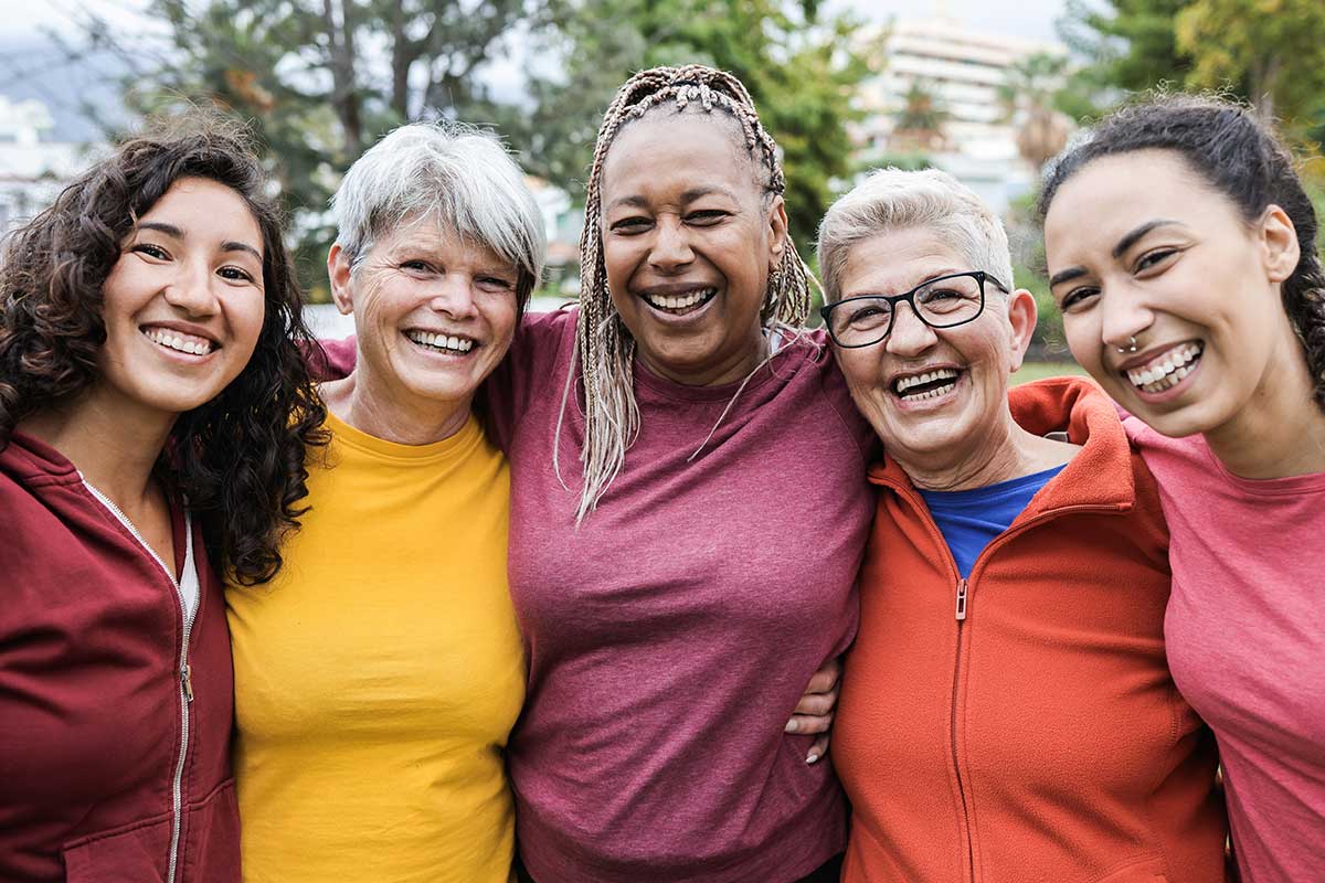 A group of women of different ages and races happy and supporting each other