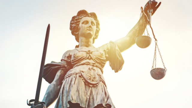 Statue of Justice with scales and sword